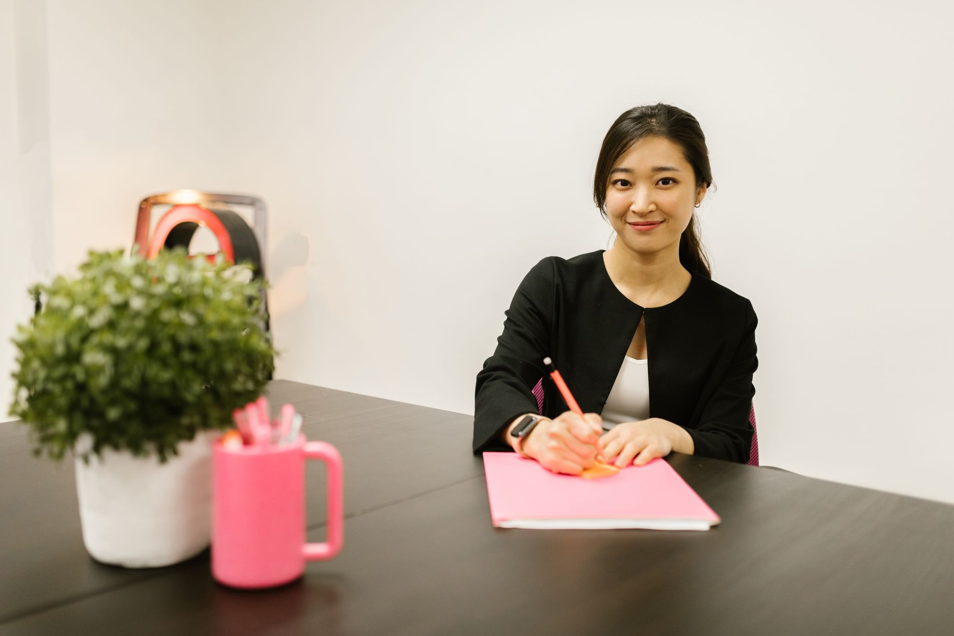 Person writing at a desk