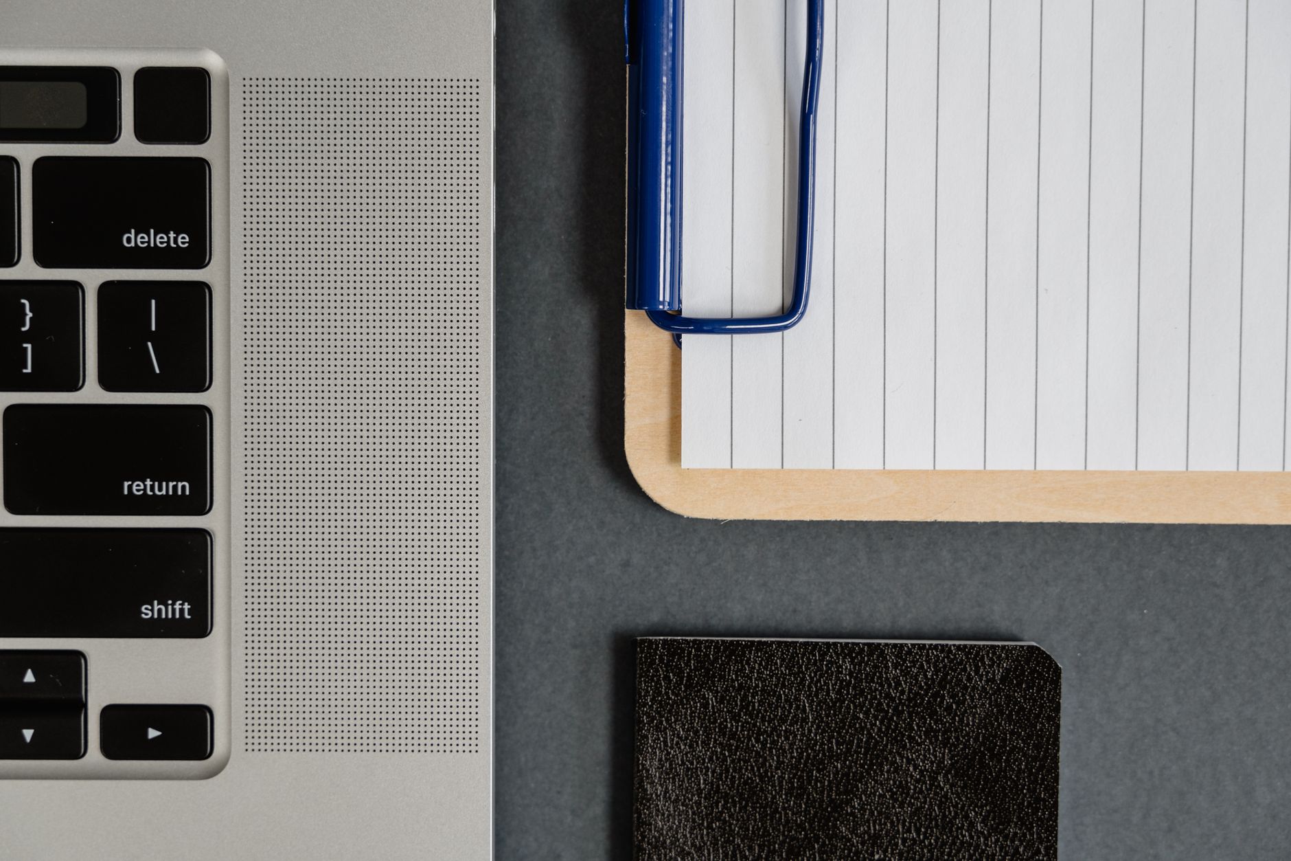 Notebook beside a laptop